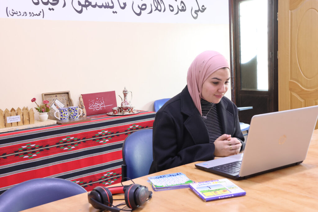 Student studying with laptop and materials